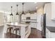 Contemporary kitchen with stainless steel appliances, a center island with seating, and modern lighting at 630 Daventry Ct, Clover, SC 29710