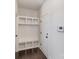 Mudroom features built-in shelving, hooks, and bench, offering practical storage solutions near the entrance at 630 Daventry Ct, Clover, SC 29710