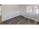 Simple bathroom with new flooring and updated fixtures at 701 Hiddenite Church Rd, Hiddenite, NC 28636