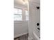 Clean bathroom with a shower/tub combo and window at 701 Hiddenite Church Rd, Hiddenite, NC 28636