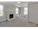 Cozy bedroom with brick fireplace and new carpet at 701 Hiddenite Church Rd, Hiddenite, NC 28636