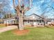 Gray house with carport and landscaped lawn at 701 Hiddenite Church Rd, Hiddenite, NC 28636