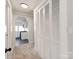 Hallway with built-in storage and view of kitchen at 701 Hiddenite Church Rd, Hiddenite, NC 28636