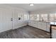 White kitchen with new cabinets and wood-look floors at 701 Hiddenite Church Rd, Hiddenite, NC 28636