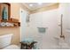 Clean bathroom with walk-in shower and stylish shelving at 7130 Meeting St, Charlotte, NC 28210