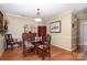 Bright dining room with hardwood floors and ample natural light at 7130 Meeting St, Charlotte, NC 28210