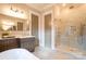 Spa-like bathroom with double vanity, large shower, and a soaking tub at 720 Ideal Way, Charlotte, NC 28209