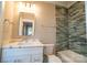 Modern bathroom with white vanity and a tiled shower/tub combo at 720 Ideal Way, Charlotte, NC 28209