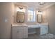 Double vanity bathroom with quartz countertops and mirrors at 720 Ideal Way, Charlotte, NC 28209