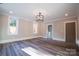 Spacious bedroom with hardwood floors and access to bathroom at 720 Ideal Way, Charlotte, NC 28209