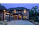 Brick two-story home with a two-car garage and a welcoming front porch at 720 Ideal Way, Charlotte, NC 28209