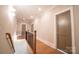 Upstairs hallway with hardwood floors and a modern railing at 720 Ideal Way, Charlotte, NC 28209