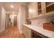 Bright hallway with built-in bench seating and a wine refrigerator at 720 Ideal Way, Charlotte, NC 28209