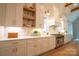 Modern kitchen with white cabinets, quartz countertops, and stainless steel appliances at 720 Ideal Way, Charlotte, NC 28209