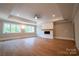 Large main bedroom with hardwood floors, fireplace, and high ceilings at 720 Ideal Way, Charlotte, NC 28209