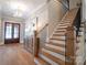 Elegant staircase with light oak treads and dark metal balusters at 720 Ideal Way, Charlotte, NC 28209