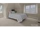 Bright bedroom with a single bed, window and carpet flooring at 7409 Stonecroft Park Dr, Charlotte, NC 28226