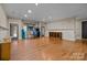 Finished basement game room with hardwood floors, arcade games, and basketball hoop at 7409 Stonecroft Park Dr, Charlotte, NC 28226