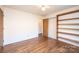 Bright bedroom with wood flooring and built-in shelving at 748 Skinner Rd, Shelby, NC 28152