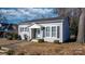 Gray house with white trim, shutters, and landscaping at 771 4Th Nw St, Hickory, NC 28601