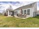 Spacious backyard with patio, screened porch and landscaping at 867 Pecan Tree Ln, Fort Mill, SC 29715