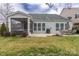 Large backyard with patio, screened porch and grassy area at 867 Pecan Tree Ln, Fort Mill, SC 29715