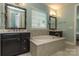 Elegant bathroom with double vanity, soaking tub, and shower at 867 Pecan Tree Ln, Fort Mill, SC 29715