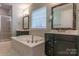 Elegant bathroom with double vanity, soaking tub, and shower at 867 Pecan Tree Ln, Fort Mill, SC 29715