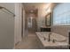 Bathroom with soaking tub, shower, and double vanity at 867 Pecan Tree Ln, Fort Mill, SC 29715