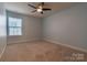 Light blue bedroom with ceiling fan and carpeted floor at 867 Pecan Tree Ln, Fort Mill, SC 29715