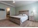 Main bedroom with attached bathroom and light color walls at 867 Pecan Tree Ln, Fort Mill, SC 29715