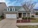Two-story home with front porch and landscaping at 867 Pecan Tree Ln, Fort Mill, SC 29715