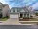 Brick front home with a two-car garage and landscaping at 867 Pecan Tree Ln, Fort Mill, SC 29715