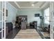 Bright home office with hardwood floors and built-in shelving at 867 Pecan Tree Ln, Fort Mill, SC 29715