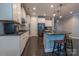 Modern kitchen with stainless steel appliances and dark wood floors at 867 Pecan Tree Ln, Fort Mill, SC 29715
