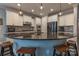 Modern kitchen with large island, stainless steel appliances, and white cabinets at 867 Pecan Tree Ln, Fort Mill, SC 29715