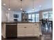 Open concept kitchen with island and view into living room at 867 Pecan Tree Ln, Fort Mill, SC 29715