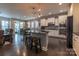 Modern kitchen with island, stainless steel appliances, and dark hardwood floors at 867 Pecan Tree Ln, Fort Mill, SC 29715