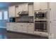 Modern kitchen with stainless steel appliances and white cabinets at 867 Pecan Tree Ln, Fort Mill, SC 29715