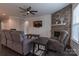 Spacious living room with fireplace, wood-look walls, and comfortable seating at 867 Pecan Tree Ln, Fort Mill, SC 29715