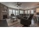 Open living room with stone fireplace and view into kitchen area at 867 Pecan Tree Ln, Fort Mill, SC 29715