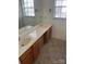 Bathroom with double vanity and tile floor at 10006 White Cascade Dr, Charlotte, NC 28269