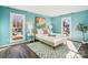 Charming bedroom with light teal walls and a comfy bed at 1011 Jaywood Ln, Matthews, NC 28105