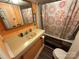 Bathroom with bathtub, sink, and peach colored vanity at 105 Richard Dr, New London, NC 28127