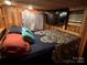 Main bedroom with TV and wood paneled walls at 105 Richard Dr, New London, NC 28127