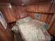 Main bedroom with wood walls and teal accents at 105 Richard Dr, New London, NC 28127