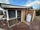 Exterior view showing screened porch and propane tank at 105 Richard Dr, New London, NC 28127