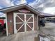 Detached garage with barn doors and Margaritaville sign at 105 Richard Dr, New London, NC 28127