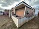 Brown house exterior with a shed and air conditioning units at 105 Richard Dr, New London, NC 28127