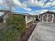 House exterior with screened porch and detached shed at 105 Richard Dr, New London, NC 28127